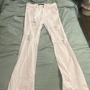 White skinny jeans with re-pared rips.